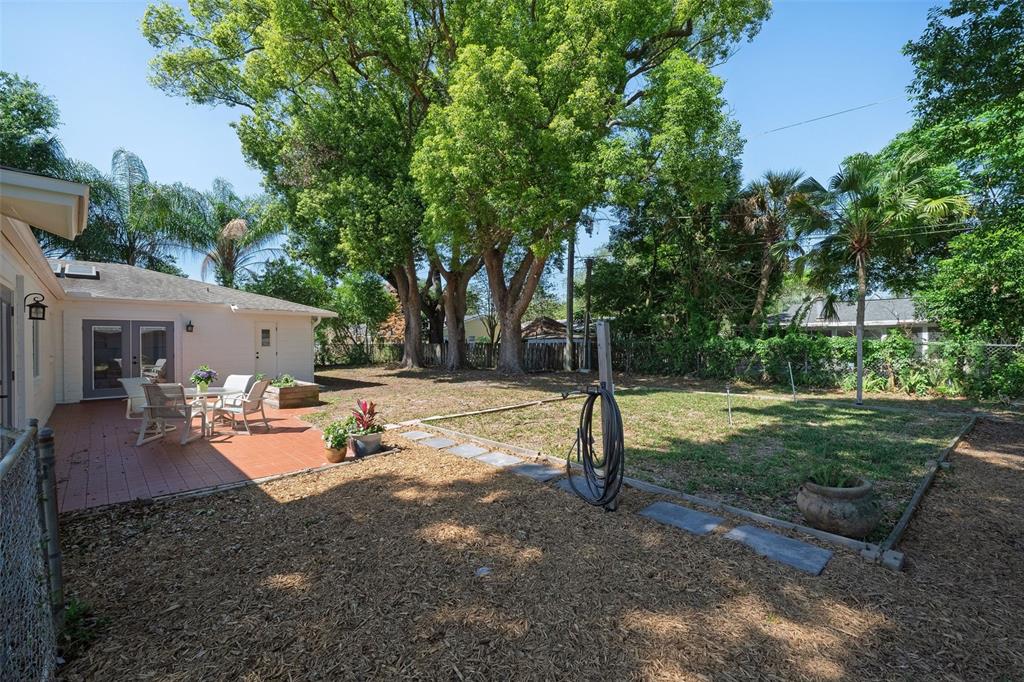 517 Roughbeard Road Winter Park, FL 32792 - Photo 22 of 53 a view of a house with backyard porch and sitting area