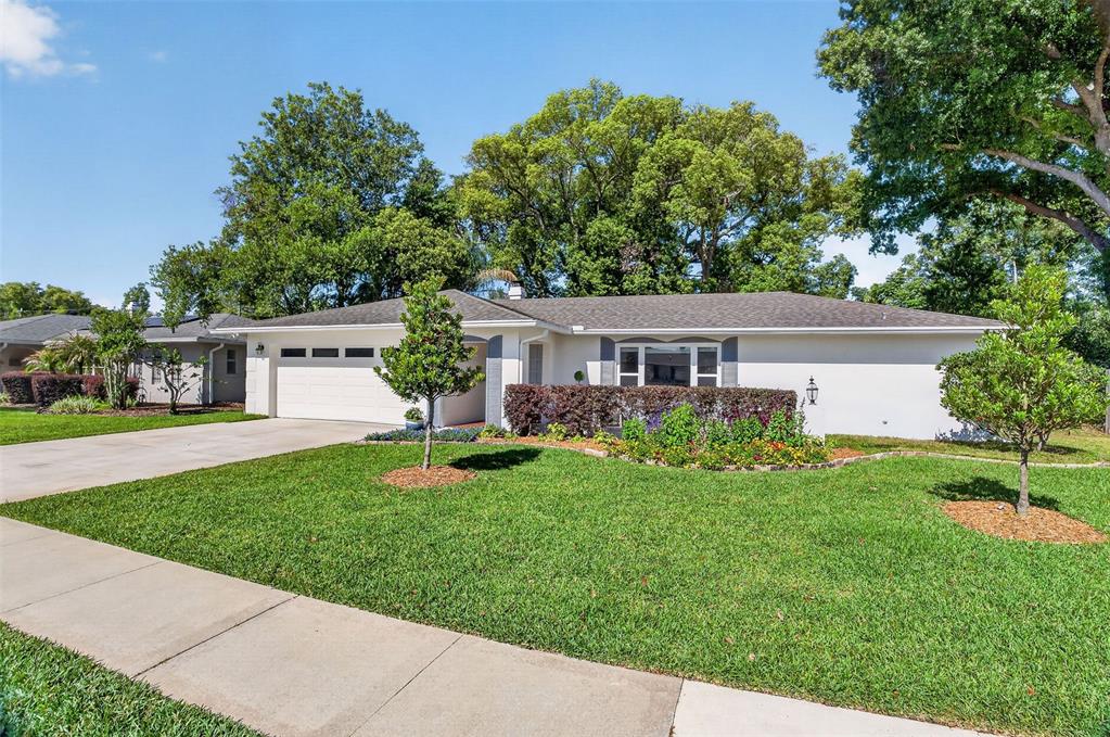 517 Roughbeard Road Winter Park, FL 32792 - Photo 24 of 53 a front view of house with yard and green space