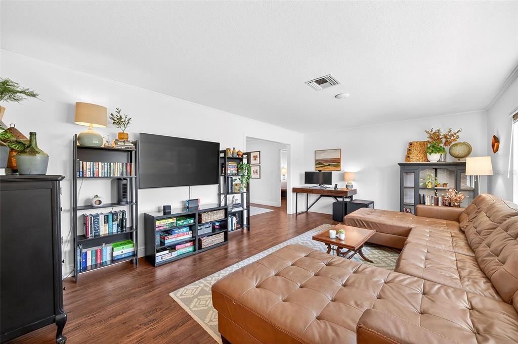 517 Roughbeard Road Winter Park, FL 32792 - Photo 3 of 53 a living room with furniture and a flat screen tv