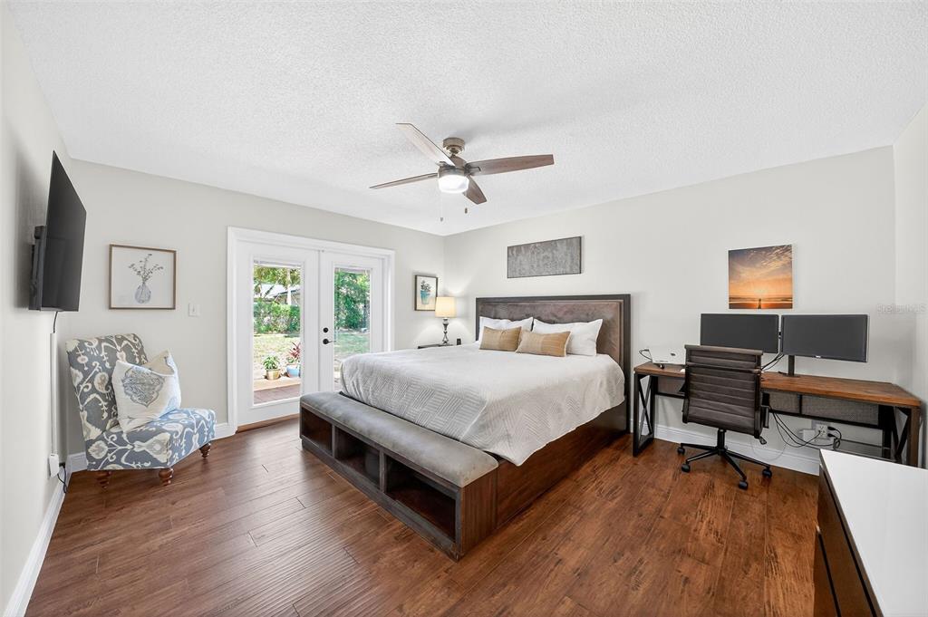 517 Roughbeard Road Winter Park, FL 32792 - Photo 4 of 53 a bedroom with a bed and wooden floor
