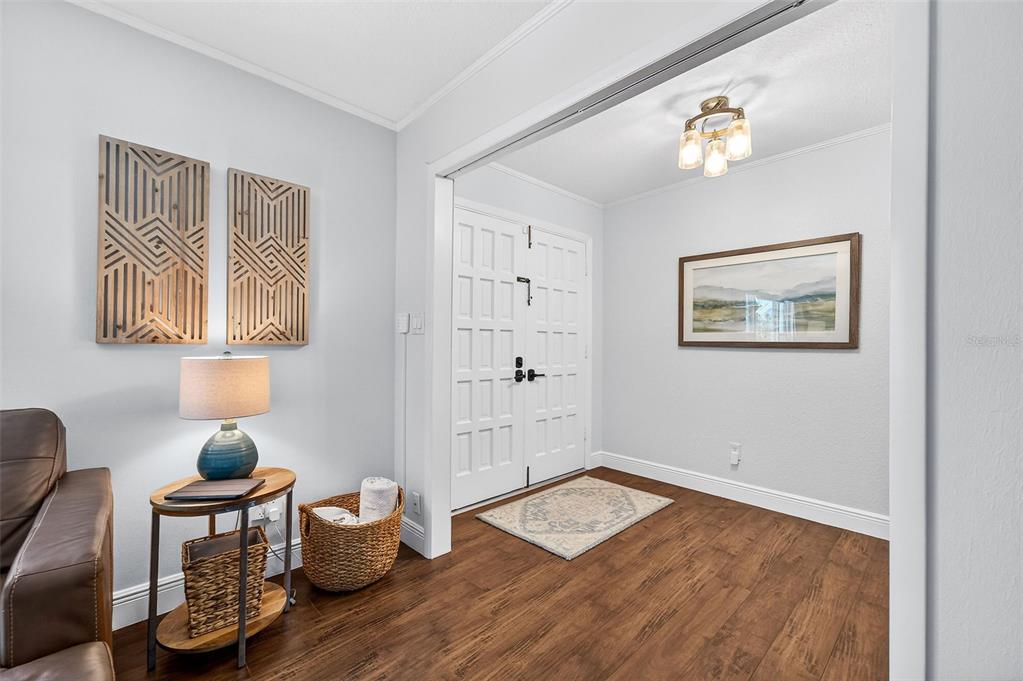 517 Roughbeard Road Winter Park, FL 32792 - Photo 42 of 53 a room with wooden floor and painting on the wall