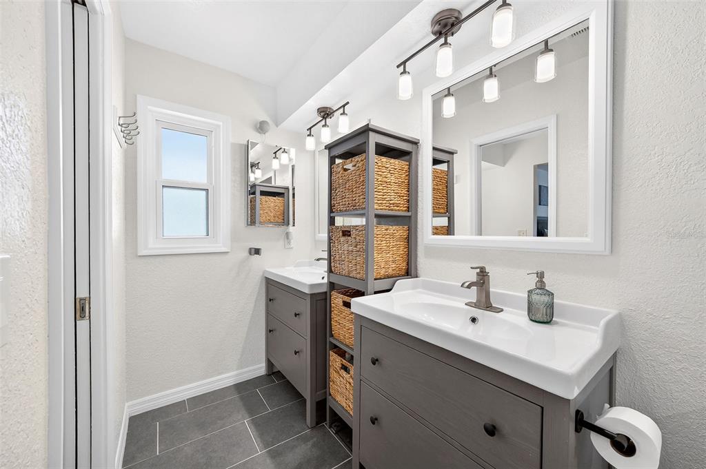 517 Roughbeard Road Winter Park, FL 32792 - Photo 7 of 53 a bathroom with a sink vanity and mirror