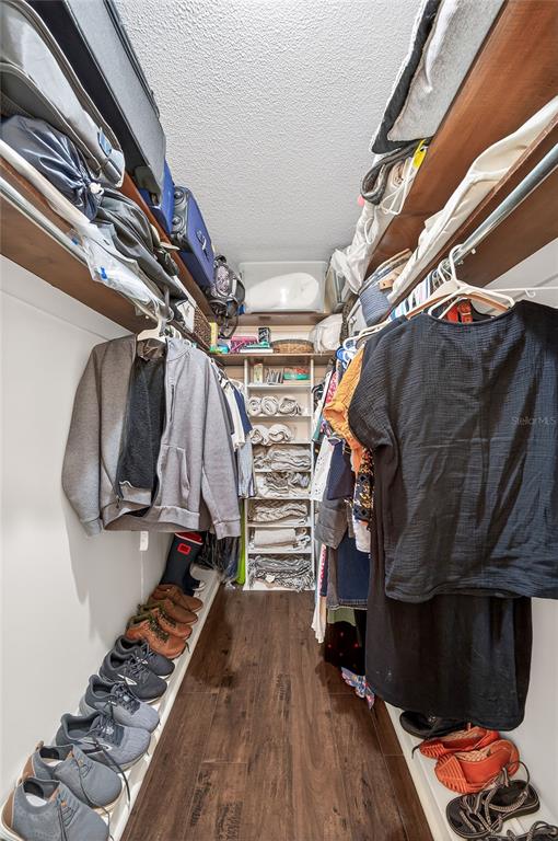 517 Roughbeard Road Winter Park, FL 32792 - Photo 9 of 53 a view of walk in closet with clothes and shoes