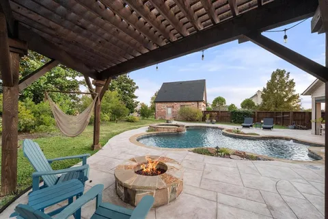 a view of a swimming pool with a patio