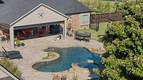 a backyard of a house with outdoor seating