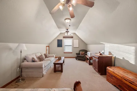 a living room with furniture a chandelier and a chandelier