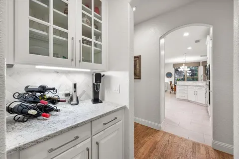 a kitchen with a sink and a refrigerator