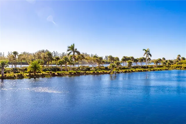a view of a lake with boats and trees