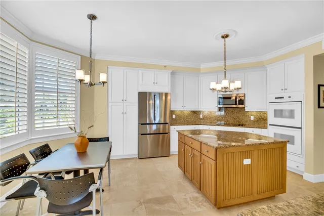 a bedroom with a bed window and a table