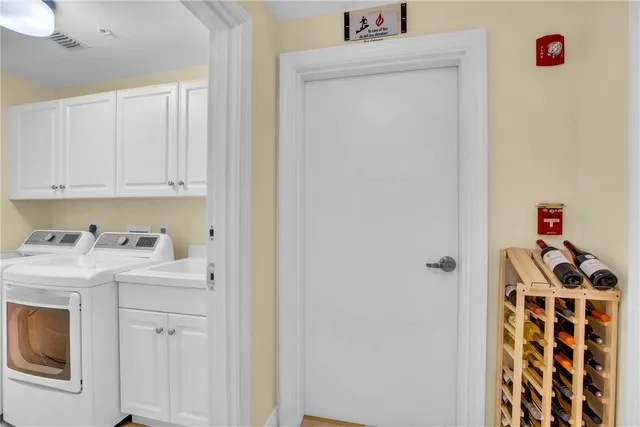 an aerial view of residential house with outdoor space and trees all around