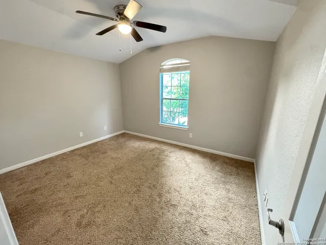 a view of an empty room and window