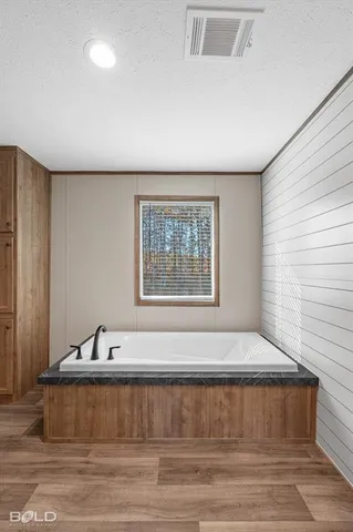 a view of a bathroom with sink and window