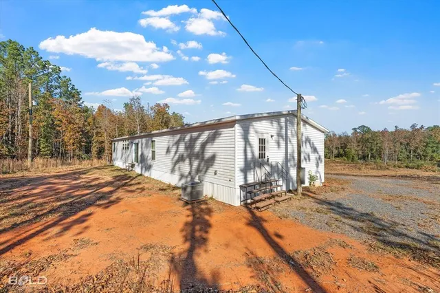 a view of a backyard of the house