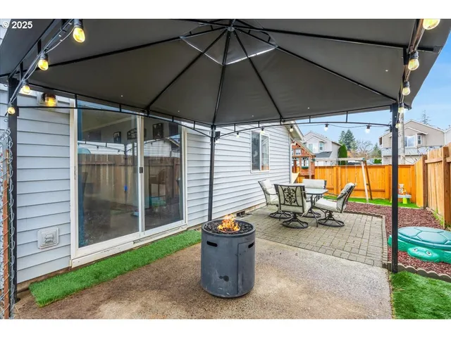 a view of a outdoor sitting area with furniture and backyard