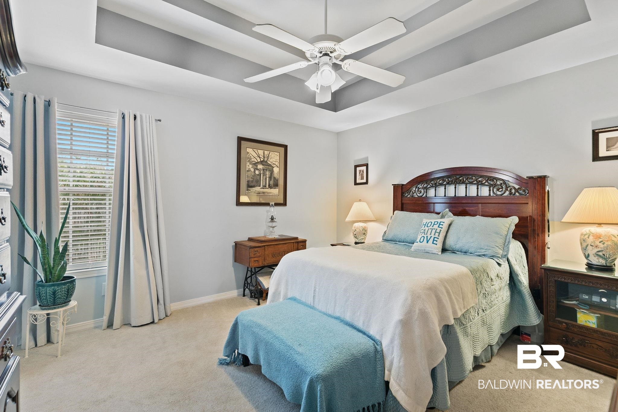 519 Juniper Place Drive Foley, AL 36535 - Photo 20 of 47 Bedroom with a raised ceiling, light colored carpet, and a ceiling fan