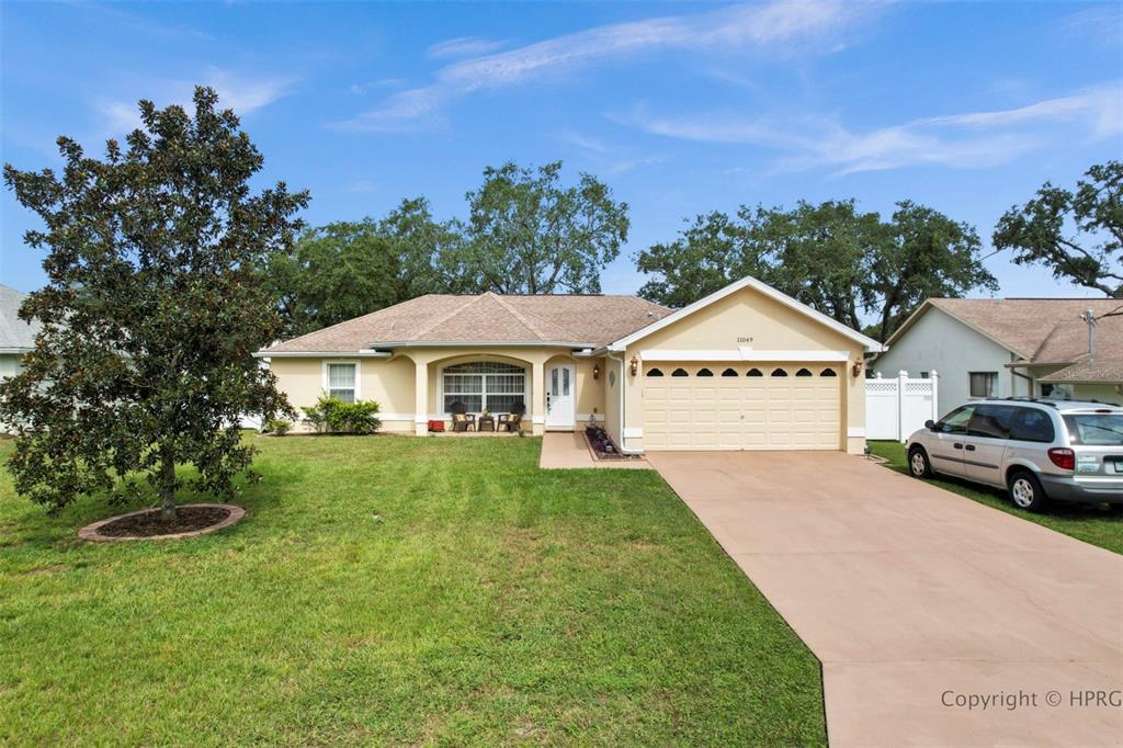 11049 Cranston Street Spring Hill, FL 34608 - Photo 1 of 1 a view of a house with garden