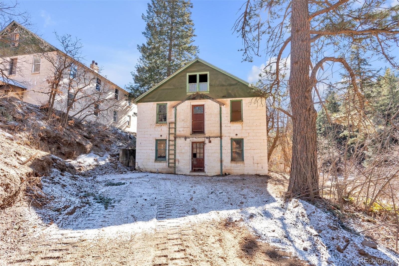 1906 Hidden Valley Road Sedalia, CO 80135 - Photo 12 of 27 a front view of a house with yard