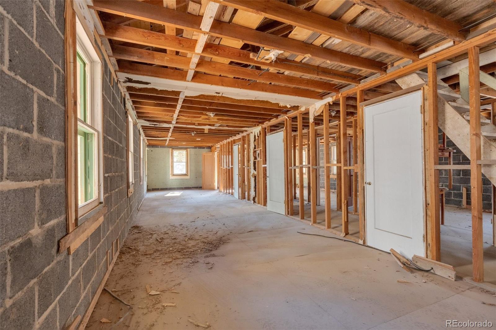 1906 Hidden Valley Road Sedalia, CO 80135 - Photo 16 of 27 a view of a room with wooden walls