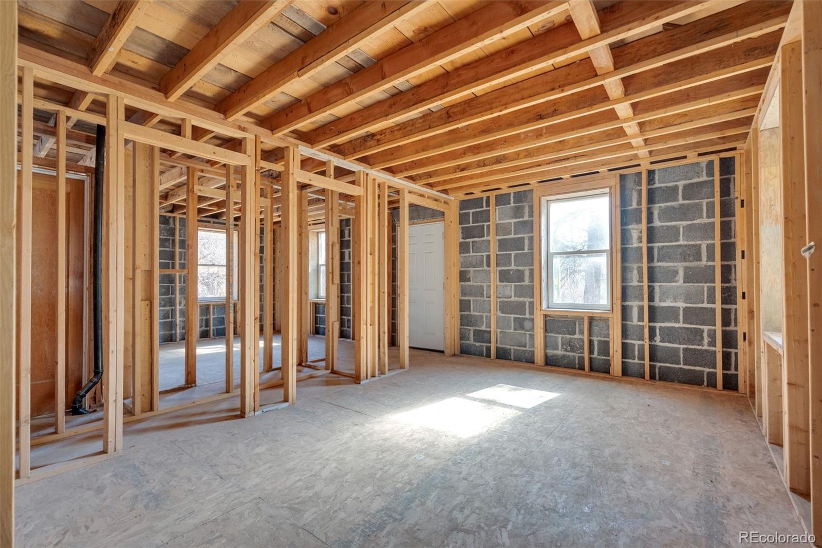 1906 Hidden Valley Road Sedalia, CO 80135 - Photo 6 of 27 an empty room with windows