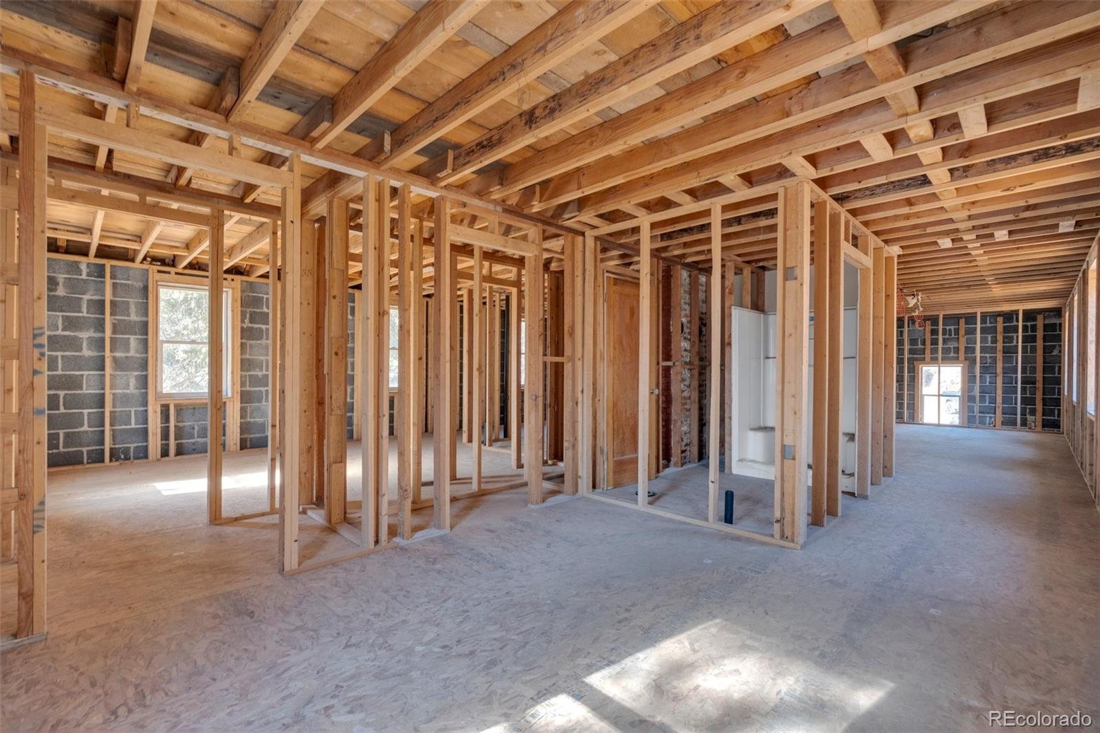 1906 Hidden Valley Road Sedalia, CO 80135 - Photo 7 of 27 a view of a room with wooden walls