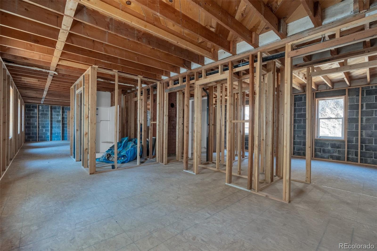 1906 Hidden Valley Road Sedalia, CO 80135 - Photo 9 of 27 a view of room with wooden walls