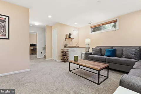 a living room with furniture and a area