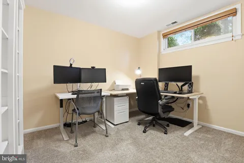 a view of a workspace with furniture