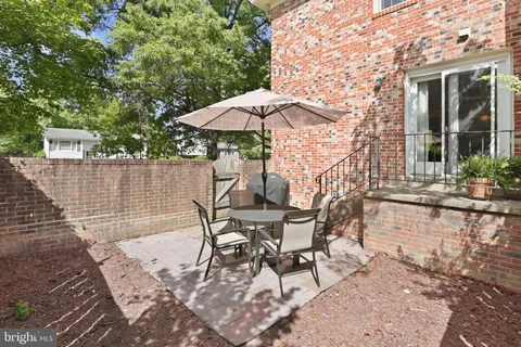 a patio with table and chairs