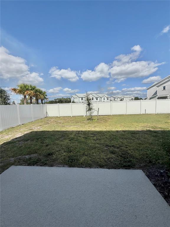 6576 Druid Way Harmony, FL 34773 - Photo 14 of 16 a view of a lake with a big yard