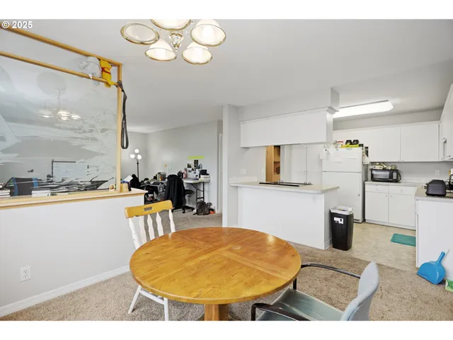 a kitchen with stainless steel appliances kitchen island granite countertop a sink and cabinets