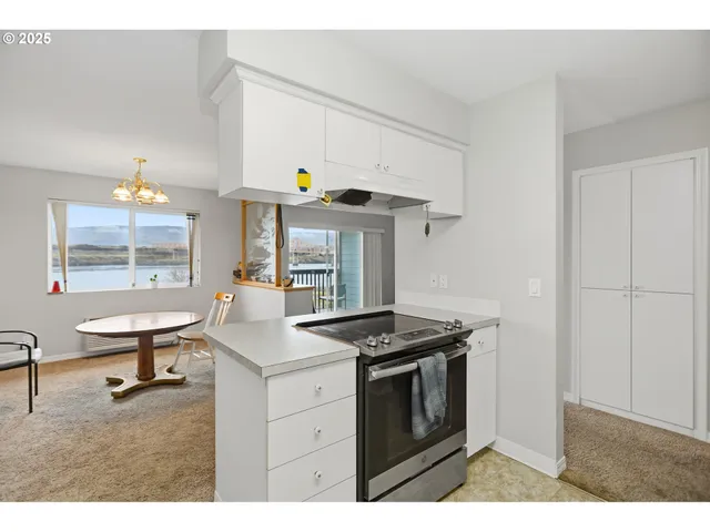 a kitchen with a stove and a table