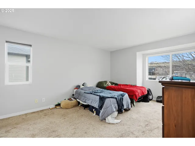 a bed room with a bed and a window