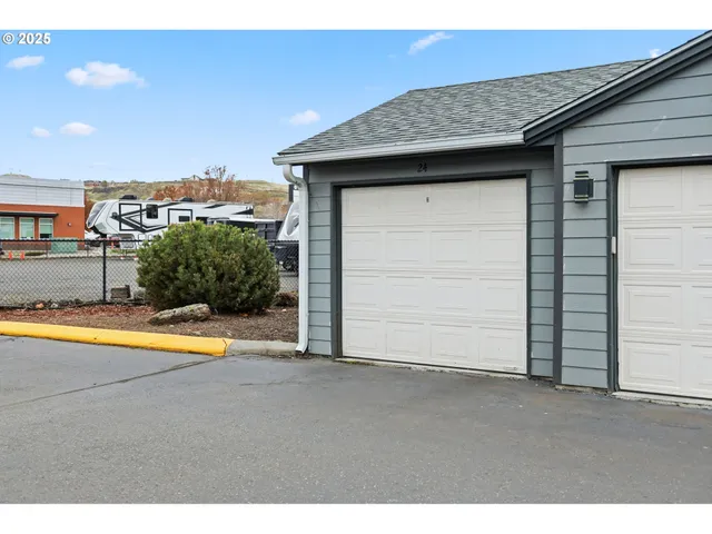 a view of an empty room with a kitchen