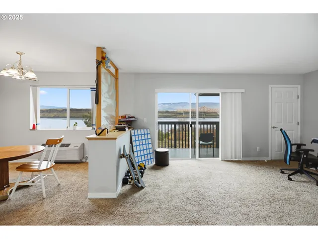a room with furniture a window and a chandelier