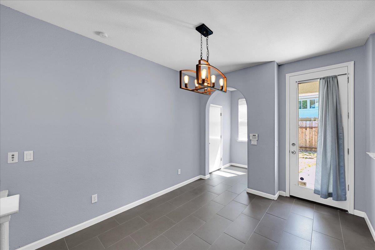 341 Barnhart Circle Sacramento, CA 95835 - Photo 14 of 55 a view of an empty room with a chandelier