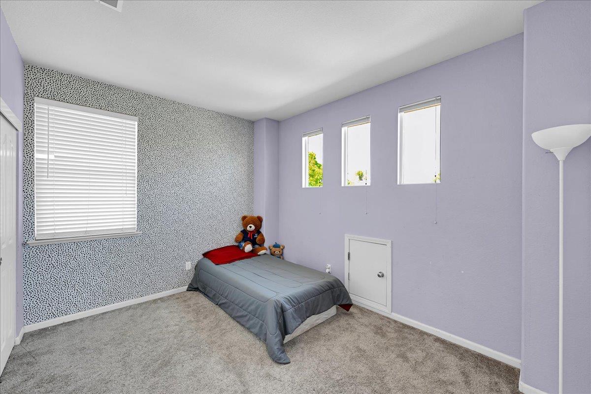 341 Barnhart Circle Sacramento, CA 95835 - Photo 23 of 55 a bedroom with a bed and a window