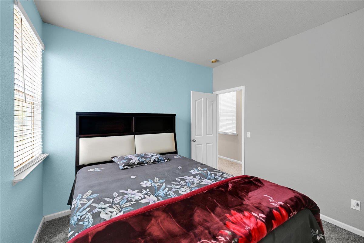 341 Barnhart Circle Sacramento, CA 95835 - Photo 29 of 55 a bedroom with a large bed and a window