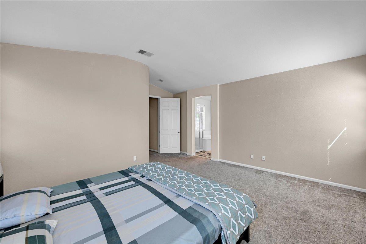 341 Barnhart Circle Sacramento, CA 95835 - Photo 31 of 55 a bedroom with a bed and a table in it