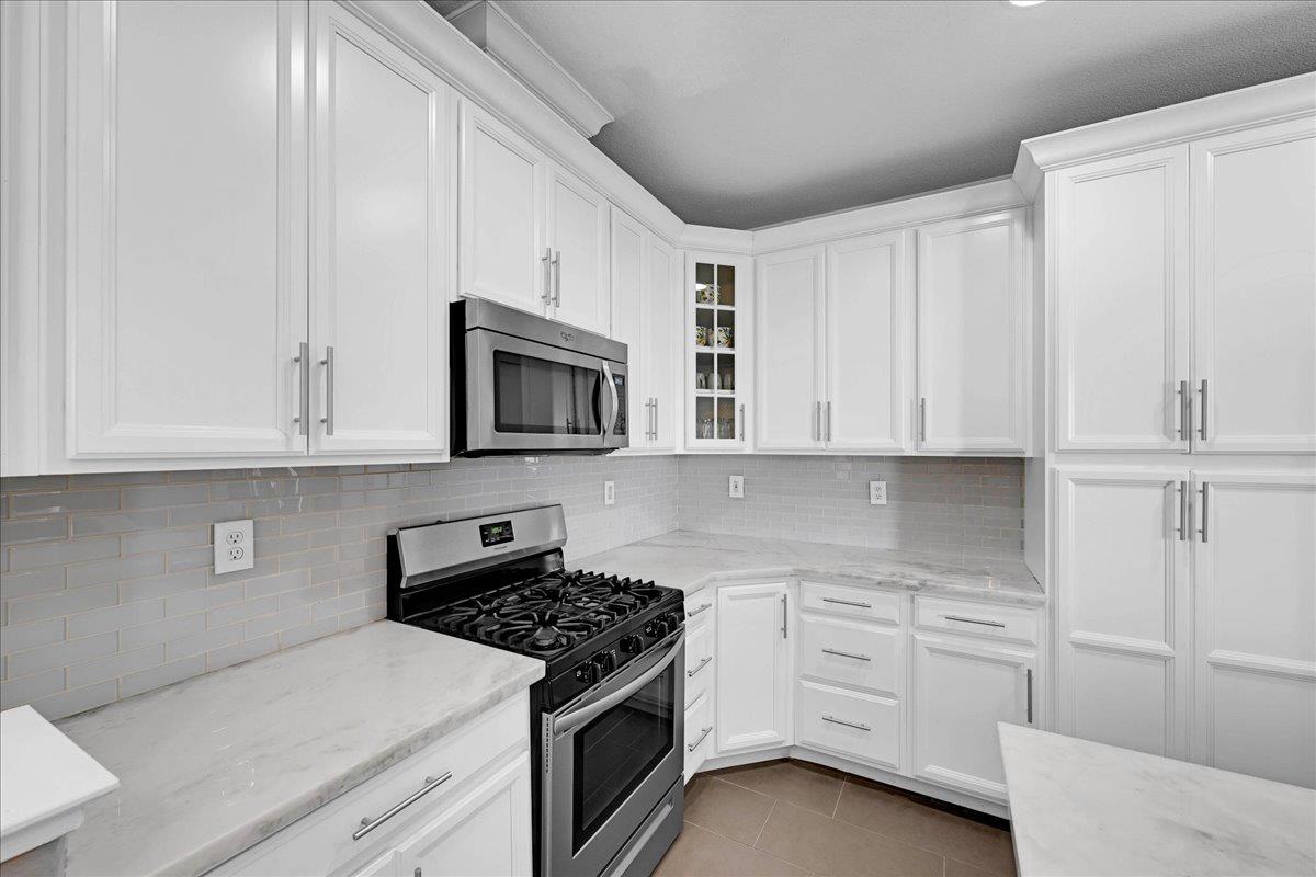 341 Barnhart Circle Sacramento, CA 95835 - Photo 5 of 55 a kitchen with white cabinets and white appliances