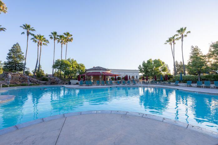 341 Barnhart Circle Sacramento, CA 95835 - Photo 53 of 55 a view of a lake with a house in the background