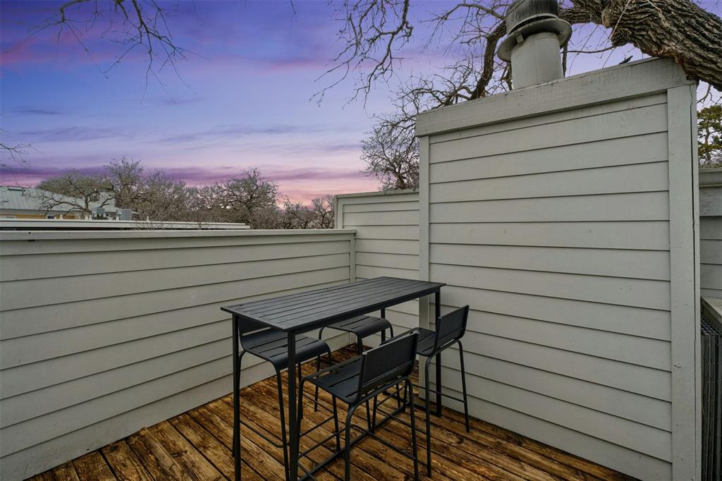 2507 Quarry Road, Unit E Austin, TX 78703 - Photo 12 of 17 Deck at dusk with outdoor dining area