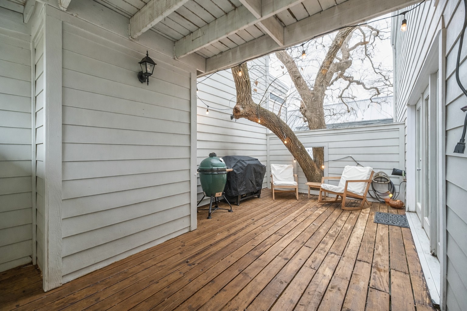 2507 Quarry Road, Unit E Austin, TX 78703 - Photo 4 of 17 Wooden deck featuring outdoor dining space and area for grilling