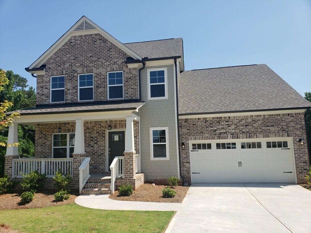 a front view of a house with yard