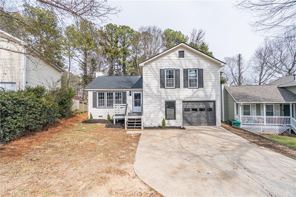 5367 Rails Way Norcross, GA 30071 - Photo 2 of 35 a view of house with outdoor space and sitting area