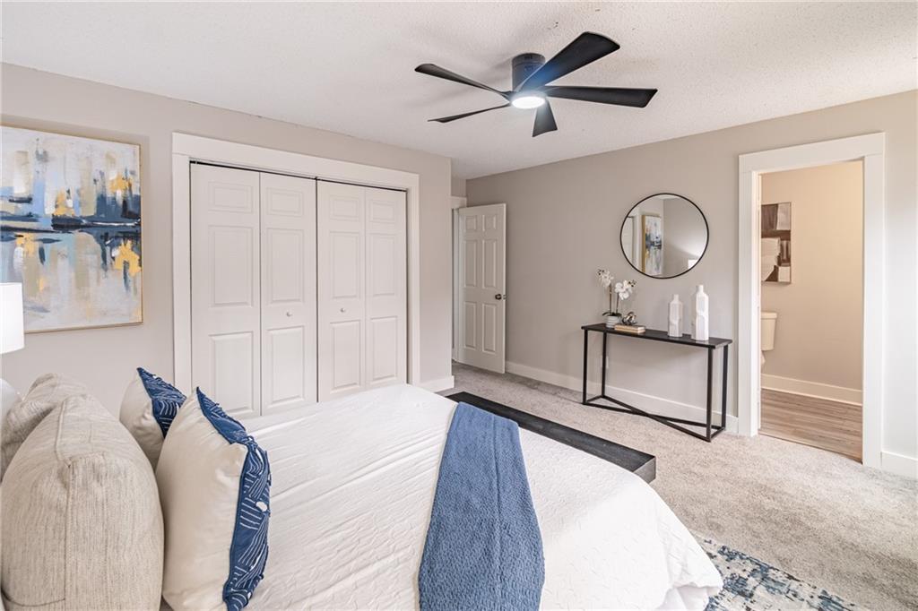 5367 Rails Way Norcross, GA 30071 - Photo 23 of 35 a living room with furniture a clock and a window