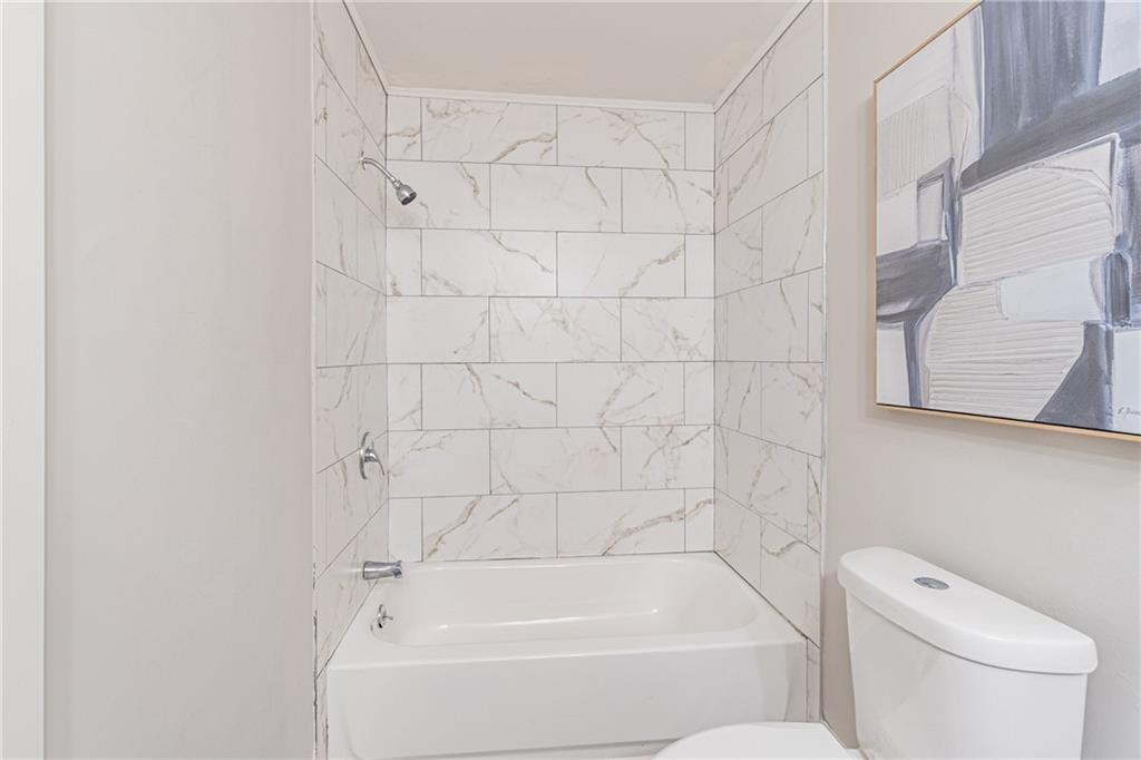 5367 Rails Way Norcross, GA 30071 - Photo 25 of 35 a white bath tub sitting next to a white toilet