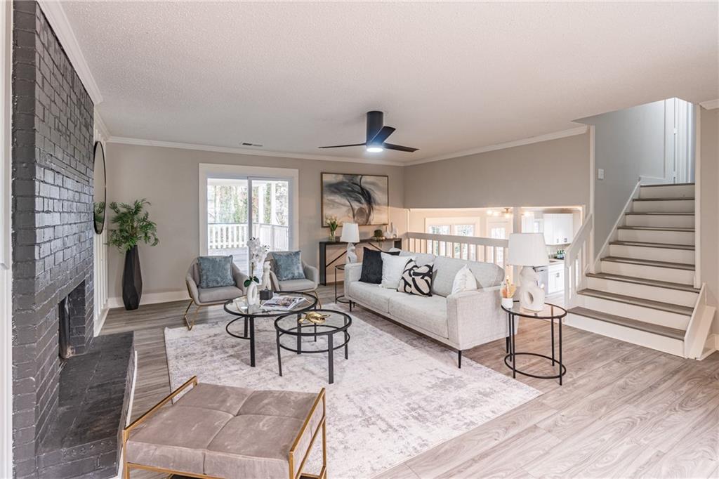 5367 Rails Way Norcross, GA 30071 - Photo 7 of 35 a living room with furniture and wooden floor