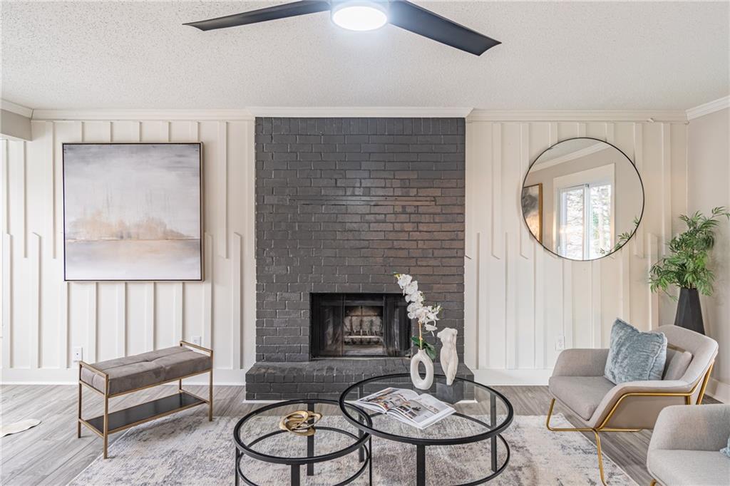 5367 Rails Way Norcross, GA 30071 - Photo 8 of 35 a living room with furniture a mirror and a fireplace