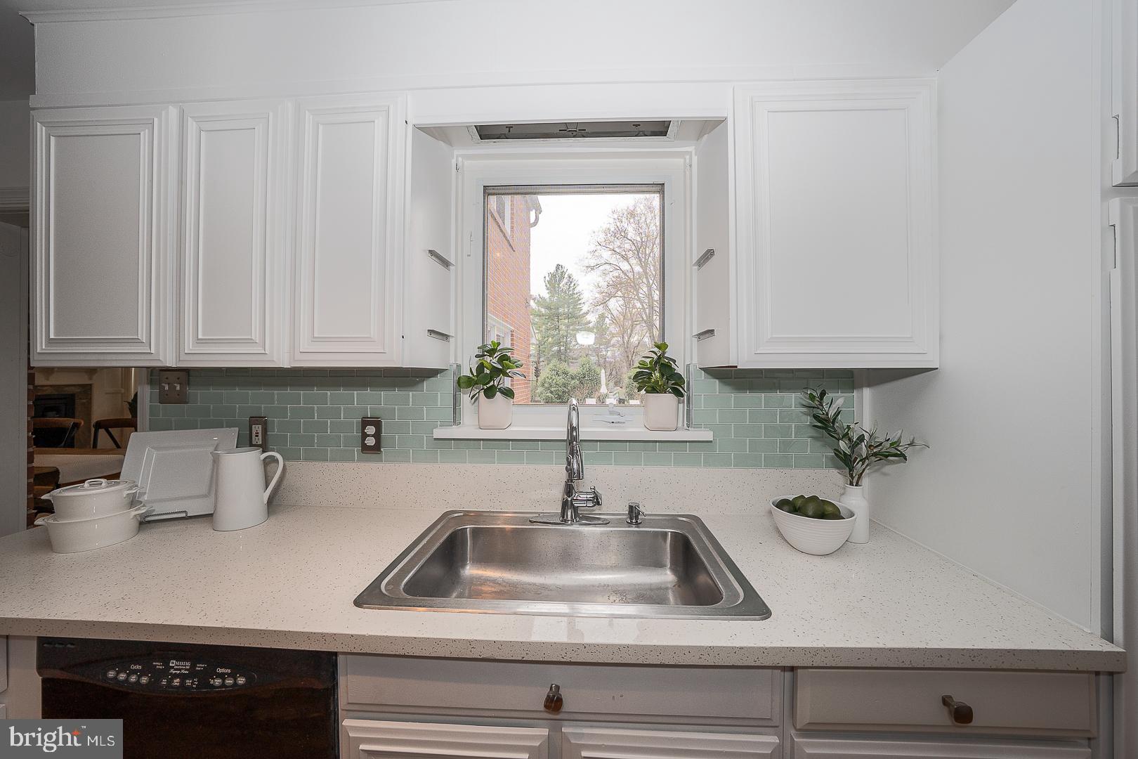 298 Strafford Avenue Wayne, PA 19087 - Photo 11 of 41 a kitchen with sink a window and cabinets