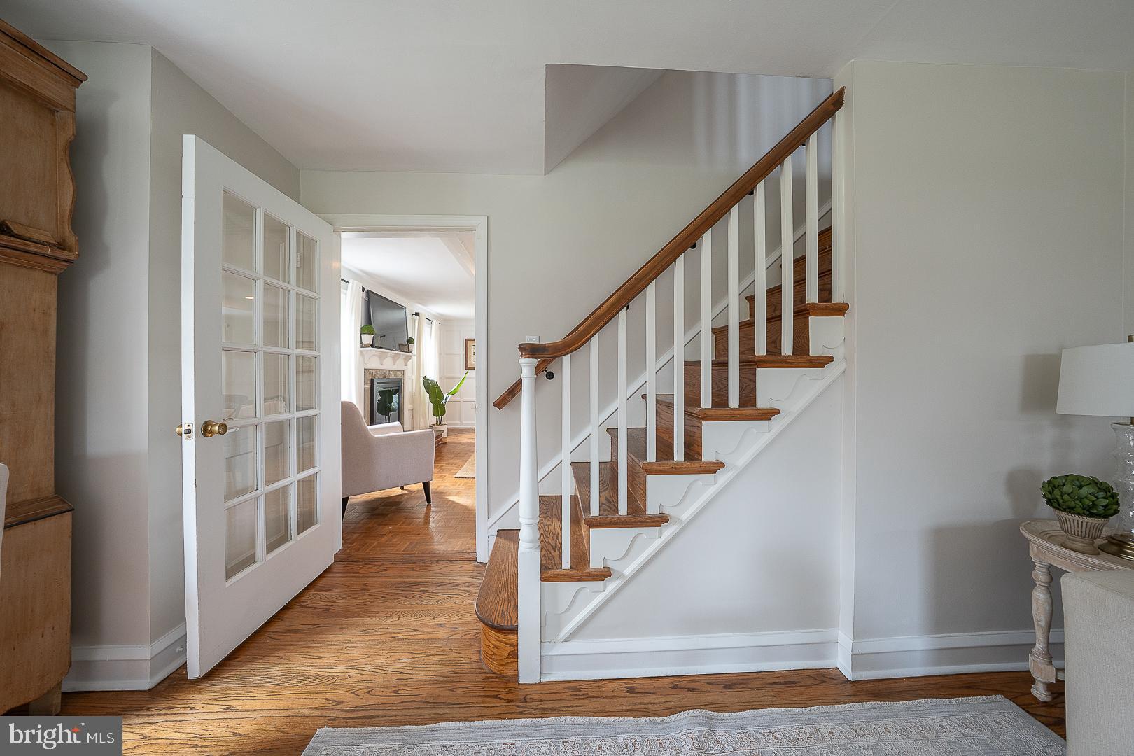 298 Strafford Avenue Wayne, PA 19087 - Photo 22 of 41 a view of staircase with lots of frames and couches